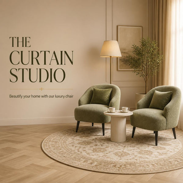 Pair of luxury green bouclé accent armchairs with matching cushions in a modern living room setting by The Curtain Studio