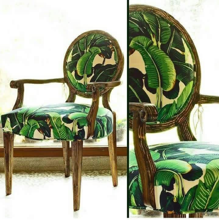 An upholstered wooden dining chair shown in a split view: a full side view on the left and a close-up of the backrest and seat on the right. The chair has a dark brown wood frame and green tropical leaf print upholstery on a light cream background.